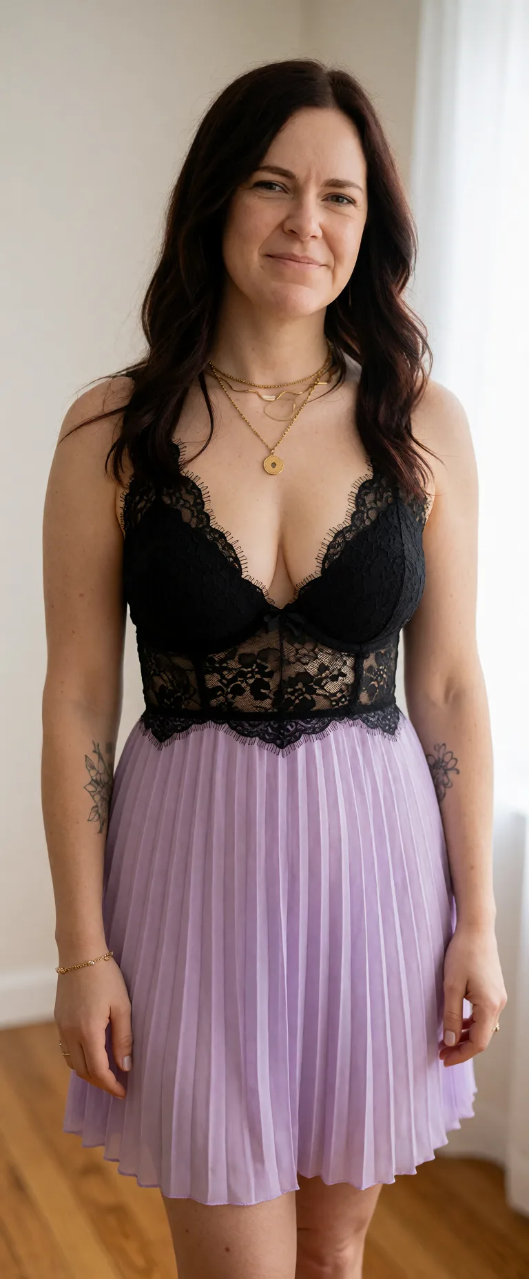 Edit the supplied photograph. Change only what is asked for below. Return one clean, natural, high-resolution photograph with realistic skin texture and no distortion. Replace her outfit with a black lace lingerie set that fits her properly. Keep her face, her identity, her hair and her skin tone exactly as they are, and keep the room and the light she is in. Keep her pose and the framing of the shot.