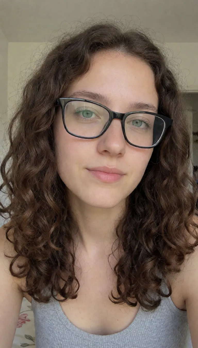 an amateur snapshot, Italian, feminine, 18-years-old, brown_hair, curly_hair, closed_eyes, tan_skin, tanlines, tall, skinny, small_breasts, small_nipples, shemale, large_testicles, wrinkly_scrotum, unkempt_pubic_hair, feet, big_feet, long_toes, soles, blue_nails, nude, black_glasses, rectangular_glasses, anus, shemale_masturbation, jerking_off, masturbation, finger_in_own_ass, lying, legs_up, clenched_teeth, sweaty, drooling, bedroom, plenty of natural daylight, flat even light, casual unposed snapshot, natural everyday colour, mild noise, natural unretouched skin, strikingly beautiful, radiant complexion, early twenties
